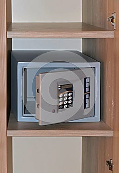 Open hotel safe on shelf
