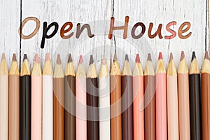 Open house message with multiculture skin tone color pencils