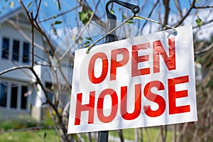 Open House sign in front of a house