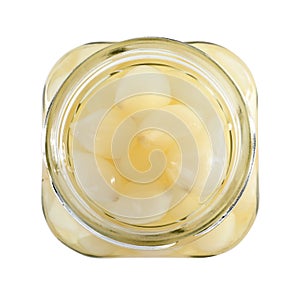 Open jar with pickled onions on white background