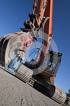 Open jaws on crusher attached to excavator photo