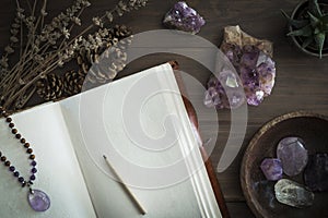 Open Journal or Notebook Surrounded by Amethyst Crystals Dried Lavender and Succulent Plant