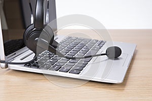 Open laptop computer with headset
