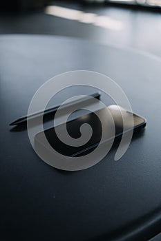 Open laptop with digital tablet and white smartphone. All with isolated screen on old wooden desk