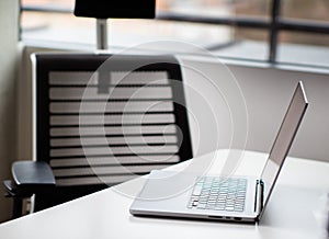 An open laptop lying on the table.