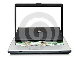 Open laptop with money