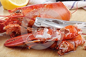 Open lobster pincer on wooden board