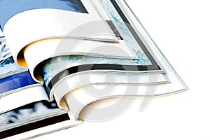 Open magazines isolated on white background