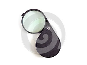 Open magnifier with folding plastic case on white