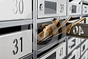 Open mailbox with keyhole, number and envelopes, closeup