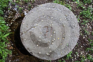 Open manhole with concrete cover