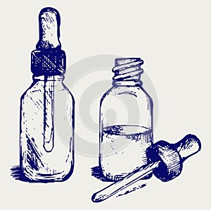 Open medicine bottle with a dropper photo