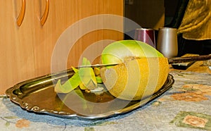 Open Melon fruit on a metal tray