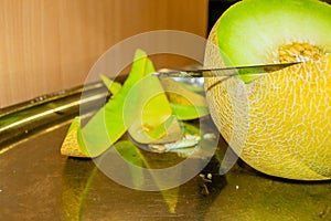 Open Melon fruit on a metal tray