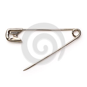 Open metal safety pin on white background