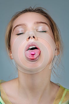 Fair-haired model with natural makeup posing with open mouth photo