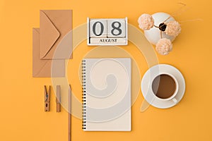 Open note, white pages, keyboard, glasses, pencil, pen, coffee on orange background. Study and working concept. Flat lay. Place
