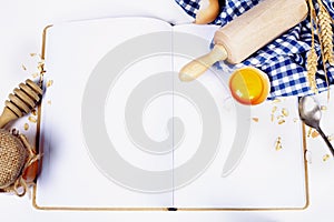 Open notebook and Basic baking ingredients