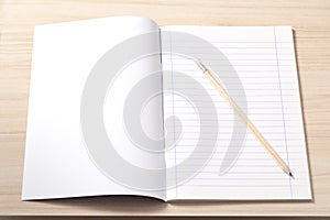 Notebook and a Pencil on a Desk