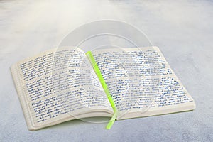 Open notebook with handwritten lorem ipsum text and ribbon book