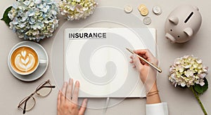 Corporate Pinterest-Style Flat Lay in Beige & Muted Turquoise with 'INSURANCE' Notebook, Gold Pen, Latte & Piggy Bank â Modern Fin