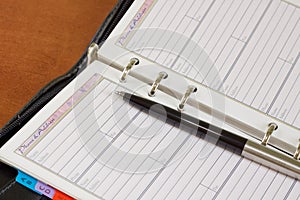 Open notebook with a pen