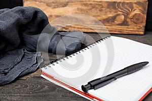 Open notebook with pen on