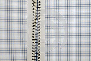 Open notebook of sheets of squared paper