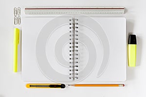 Open notebook with stationaries
