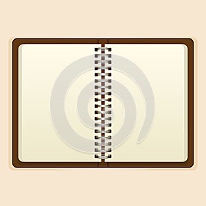 Open notebook with white page on beige background