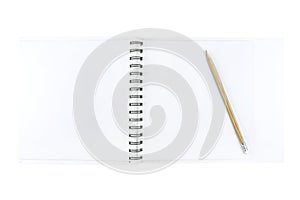 An open notebook with white pages and a wooden pencil lying on the right, isolated on a white background with a clipping path.