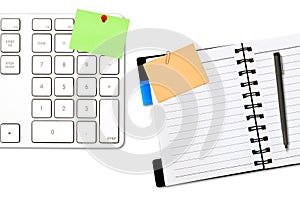 Open notepad and colored memo with keyboard