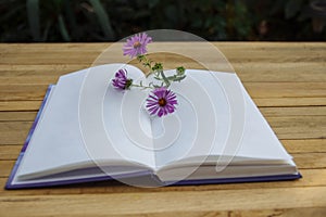 Open notepad with flower and copy space