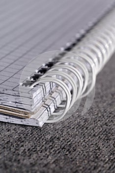 Open notepad with spring-bound binding closeup