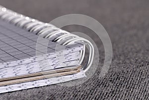 Open notepad with spring-bound binding. Shallow depth of field