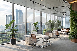 Open office workspace with desks, chairs, and plants photo