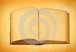 Open old book against retro background