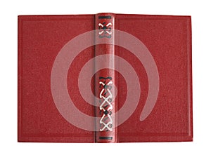 Open old book with vintage red cover isolated on white