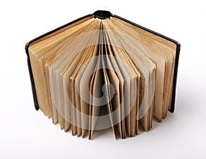 Open old book on white background