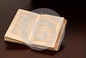 An open old German bible resting on a table