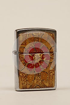 Open old lighter in red and beige cap. Lighter with a brand or logo can be printed on the lid.