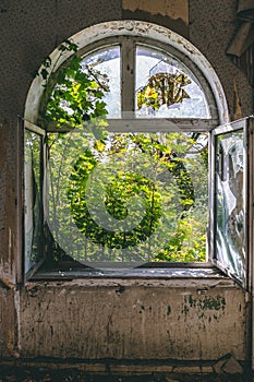 Open old window with destroyed glass