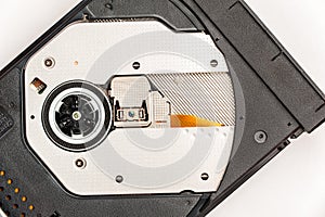 Open optical CD/DVD disc drive on a notebook.