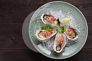 Open oyster stuffed with papper and lemon