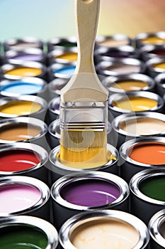 Open paint cans with a brush, Rainbow colors