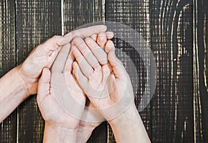 open palms of female and child`s hands