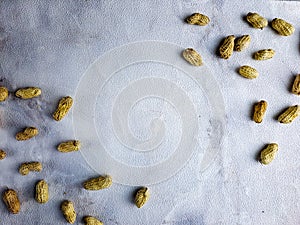 Open peanuts shot macro in studio, white wall texture background