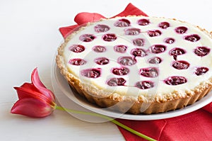 Open pie with cottage cheese and cherries