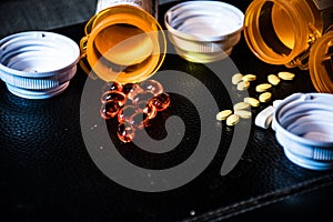 Open pill bottles capsules and pills pharmaceutical big pharma health care medicine