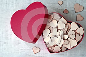 Open pink heart shaped gift box with hearts on grey background. Design for Valentine's Day